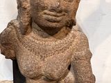 statue of a man with a head on a black stand