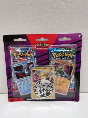 two packs of pokemon trading cards are on a white surface