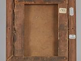 an old wooden picture frame with a label on it