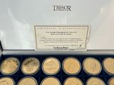 a box full of gold coins with a certificate on it