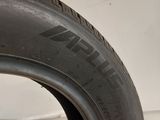 a close up of a tire on a white surface