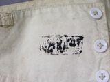 a close up of a shirt with buttons on it