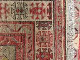 an image of a close up of a rug on a blue surface