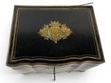 an image of a black and gold box sitting on a white surface