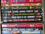 many dvds are stacked on top of each other in a box