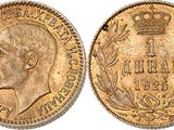 a gold sovereign coin with a crown on top of it