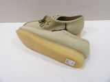 men ' s tan sued boat shoes with tassels on the sole