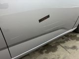 a close up of a car door with a sticker on it