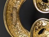 a close up view of a gold colored metal object