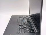 a laptop computer sitting on top of a white table