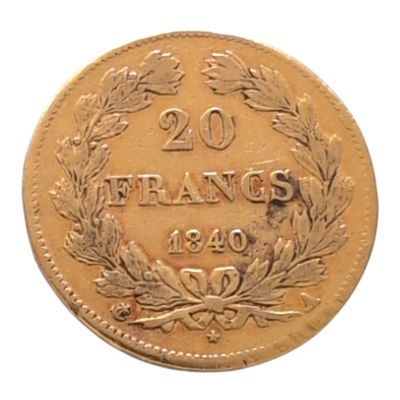 une ancienne pièce française de 20 francs sur fond blanc