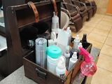 a wooden box filled with different types of hair products