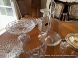 a lot of glass dishes on a table in a room