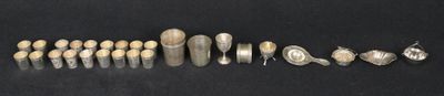 many different types of silverware laid out on the table