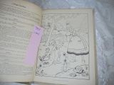 an open book with a drawing of a woman and a cat
