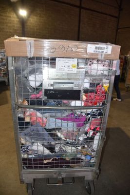 a cart full of electronic equipment in a warehouse