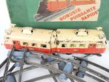 a toy train on the tracks next to a box of train tracks