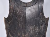 a close up of a metal armor on a white background
