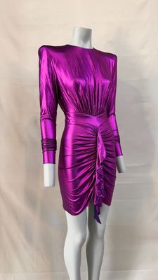 a mannequin dressed in a purple dress on a mannequin mannequin