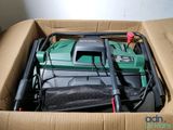 a box with a lawn mower inside of it