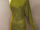 a green dress on a mannequin mannequin stand with a mannequin mannequin