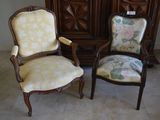 two chairs sitting next to each other in a room