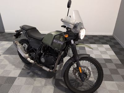 a motorcycle that is sitting on a checkered floor