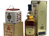 an image of a bottle of whisky next to a box of cigarettes