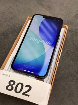 a box with a phone in it sitting on top of a table