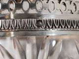 a close up of a glass jar with a silver lid