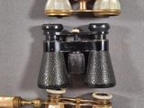 an image of a pair of binoculars sitting on top of a table