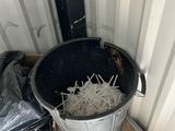 a bucket full of shredded onions sitting on the floor