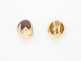 a pair of yellow gold and diamond earrings