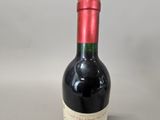 a bottle of wine that is sitting on a table