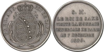 gros plan d'une pièce de monnaie surmontée d'une couronne