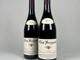 deux bouteilles de vin rouge posées l'une à côté de l'autre sur une table