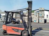 a forklift that is sitting on the side of the road