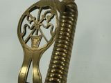 a close up of a sword with a decorative design on it