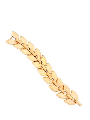a close up of a gold bracelet on a white background