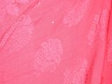 a close up of a woman ' s hair and a pink dress