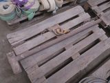 a pile of old wooden pallets with rope on them