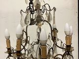 a chandelier that has a lot of lights hanging from it