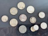 a lot of coins that are sitting on a table