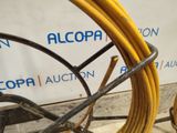 a yellow hose that is sitting on a cart