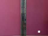 a tall metal pole in the middle of a room