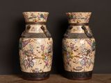two vases that are sitting on a table