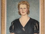 portrait of a woman in a black dress with a pearl necklace