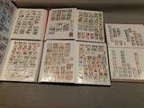 a lot of stamps on the pages of a book