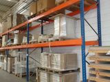 many shelves with boxes and boxes on them in a warehouse