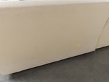 a white couch that is sitting in a room